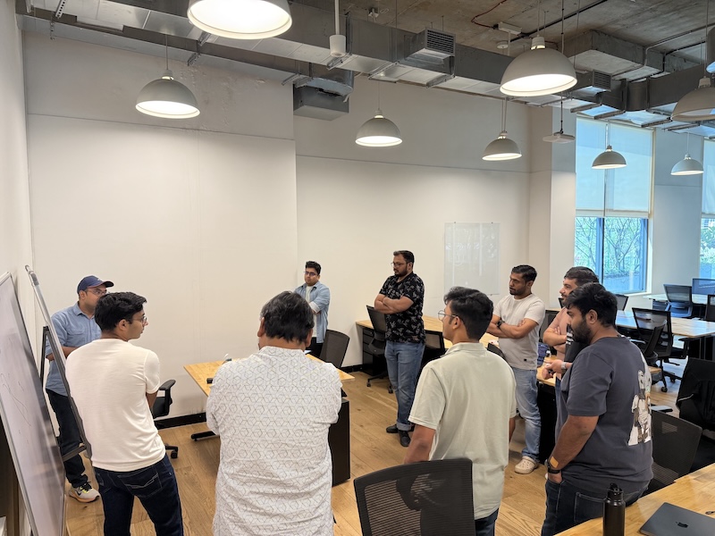 Team collaborating around whiteboard